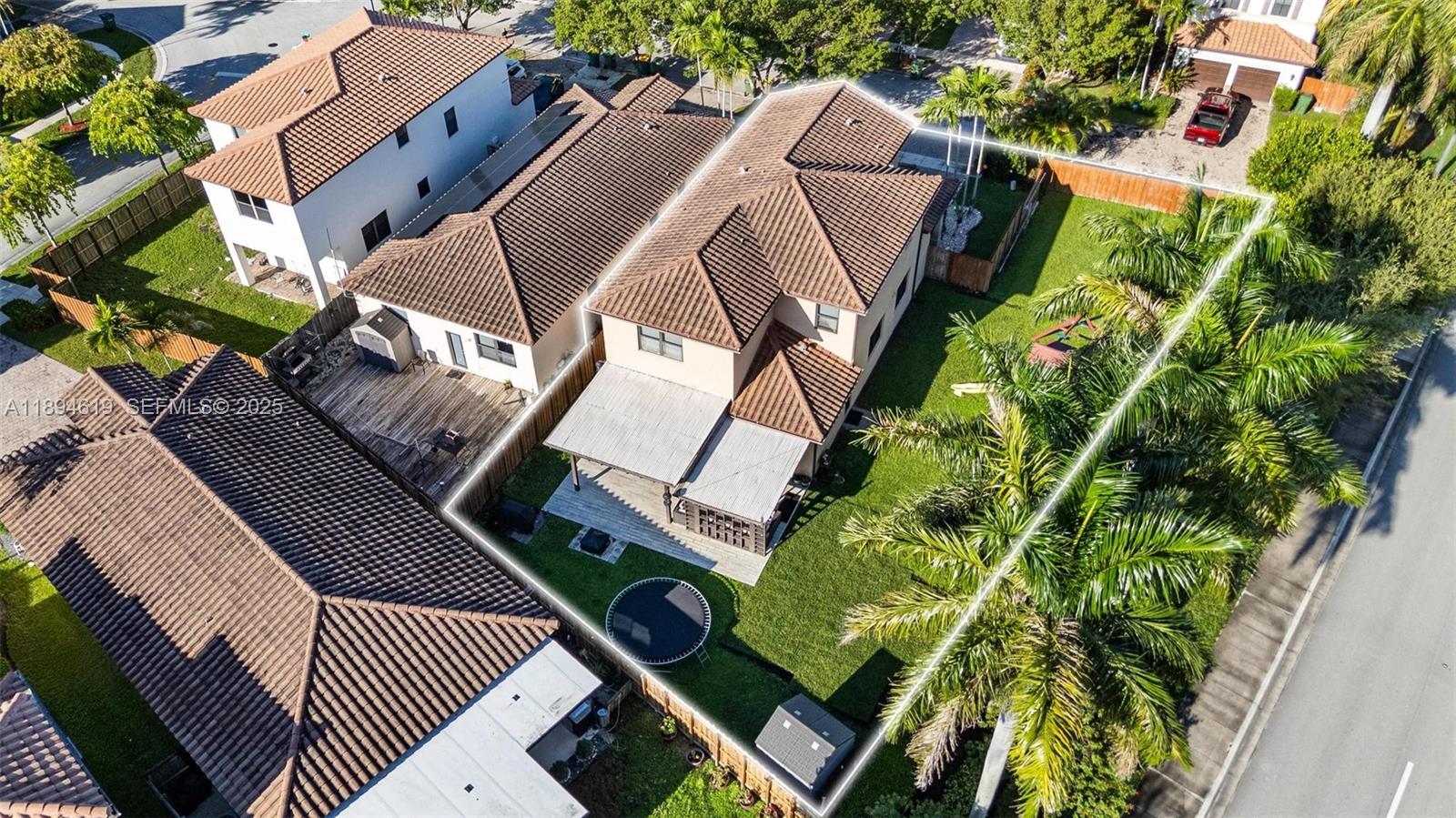 415 Southeast 34th Terrace Homestead, FL 33033 - Photo 46 of 60 an aerial view of a backyard with outdoor seating