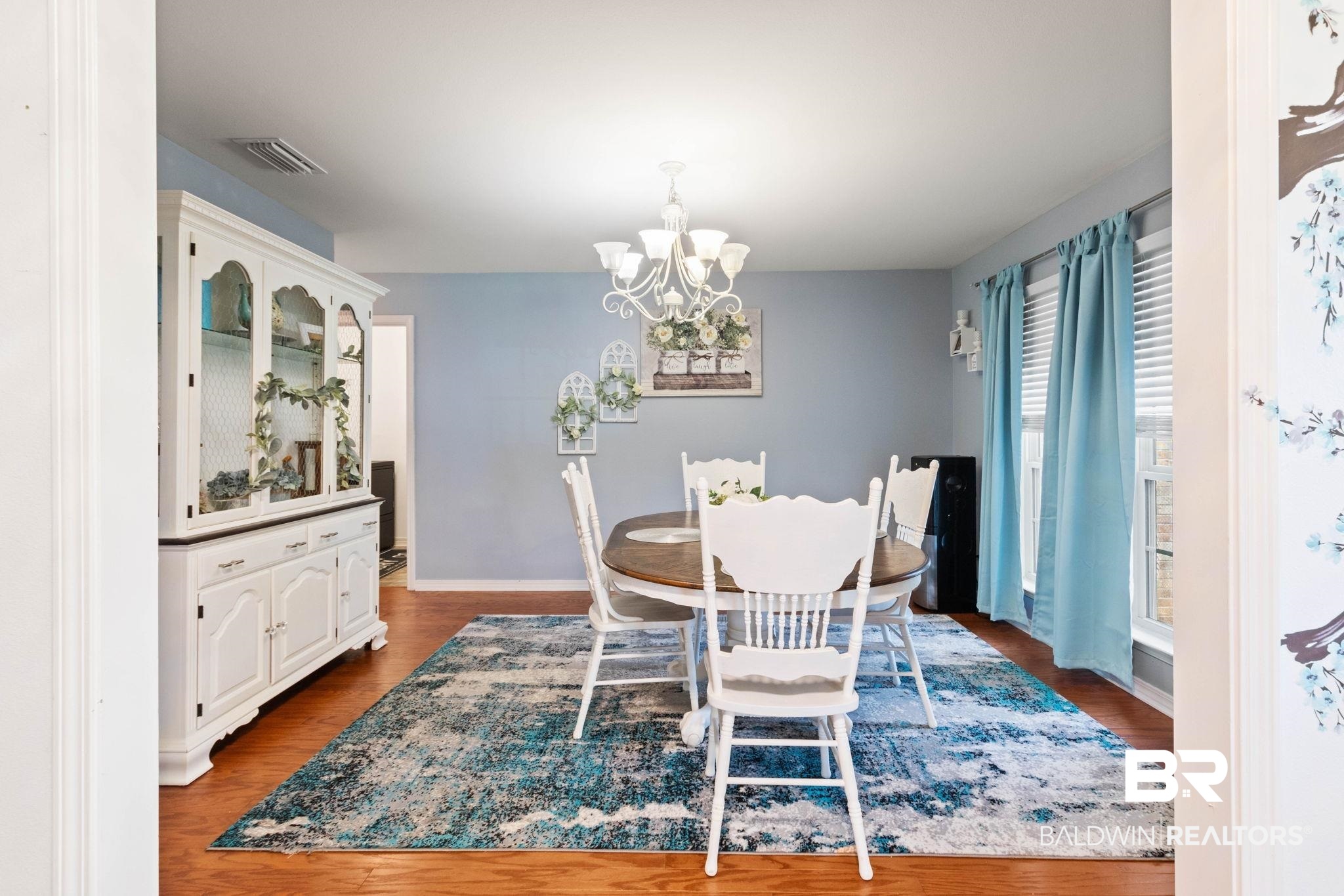 16151 Tolbert Road Bay Minette, AL 36507 - Photo 24 of 74 Spacious dining area featuring wood-finish flooring, a decorative chandelier, and a large window with blinds