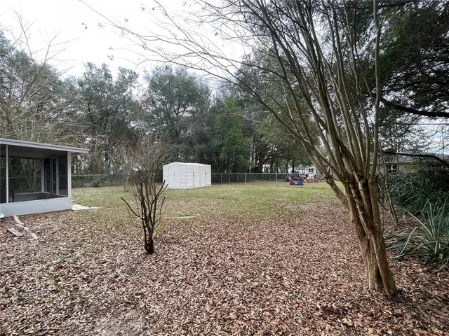 a backyard of a house with lots of green space