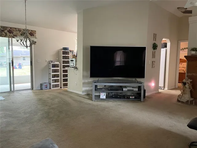 a room with furniture and a flat screen tv