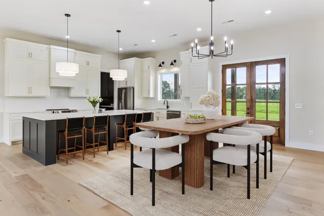 a open kitchen with a table and chairs in it