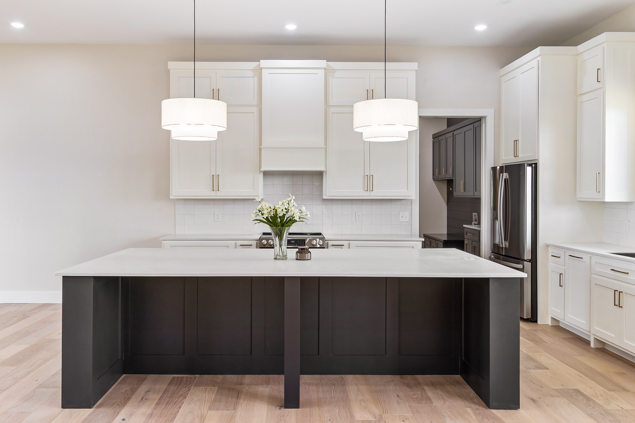 188 Beartown Road Loretto, TN 38469 - Photo 13 of 33 a kitchen with a refrigerator a sink and wooden floor