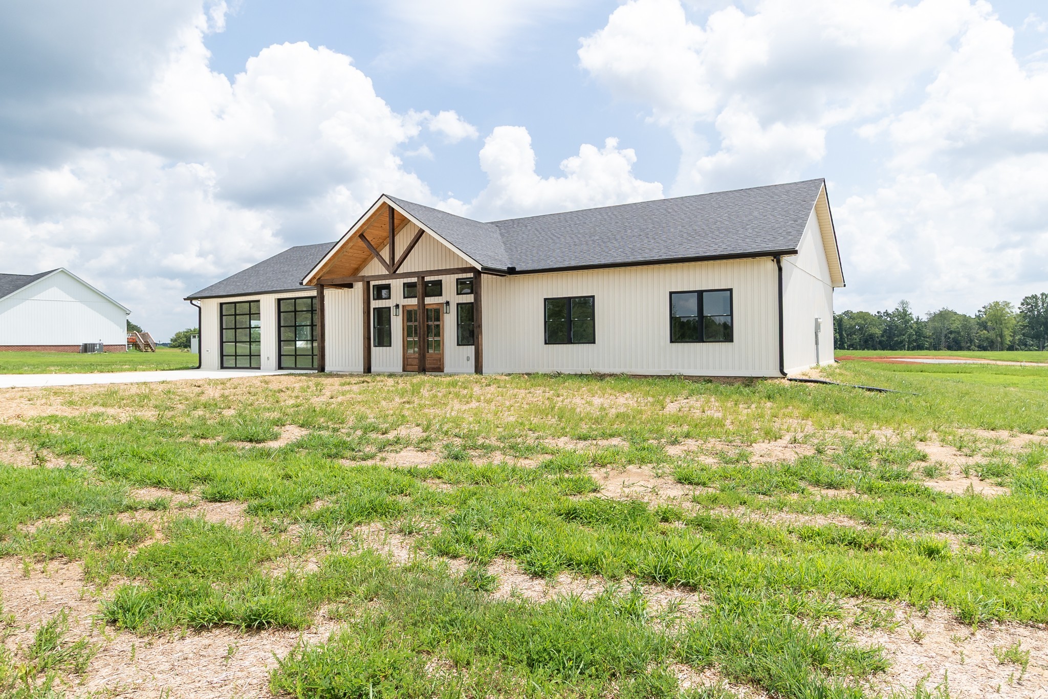 188 Beartown Road Loretto, TN 38469 - Photo 30 of 33 a front view of a house with a garden