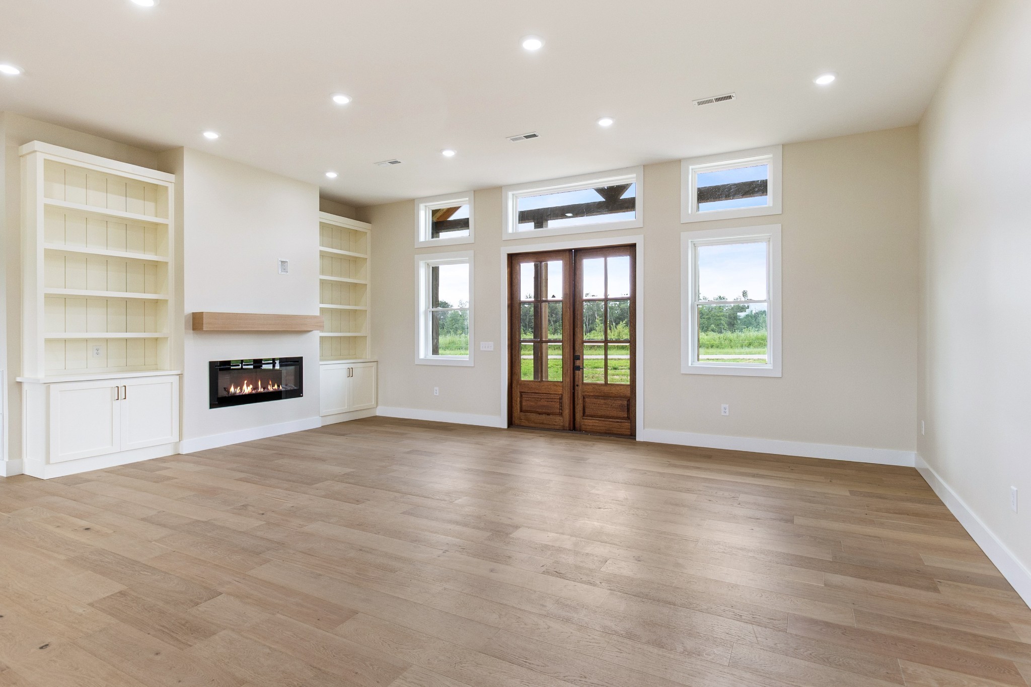 188 Beartown Road Loretto, TN 38469 - Photo 5 of 33 an empty room with windows and fireplace