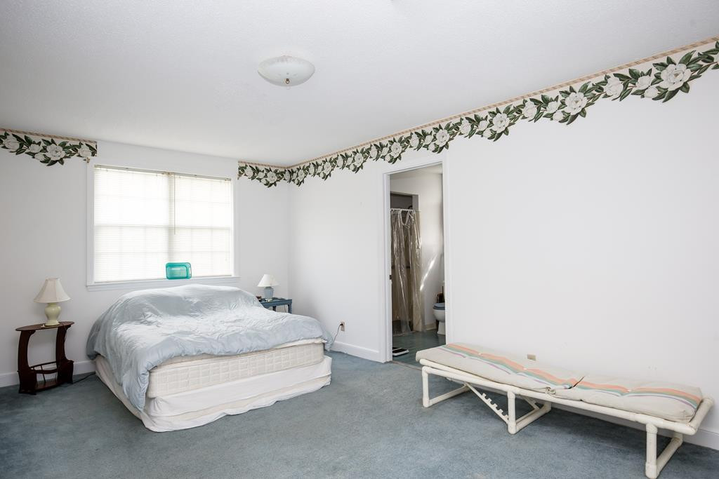 499 Pine Street Bamberg, SC 29003 - Photo 21 of 28 a spacious bedroom with a bed and a window