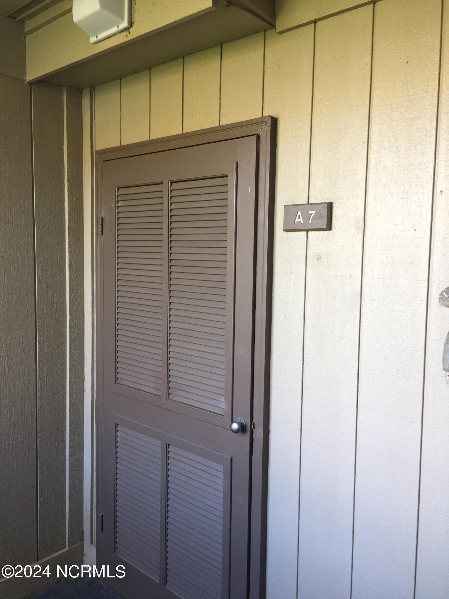 2008 East Fort Macon Road, Unit A7 Atlantic Beach, NC 28512 - Photo 1 of 19 SW A07 Front Door/Elevation