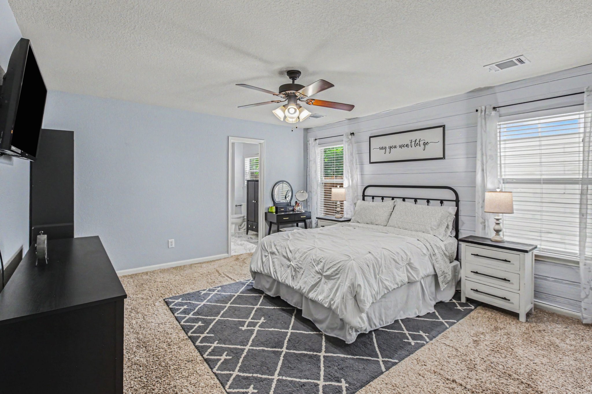 2903 Swift Brook Glen Way Spring, TX 77389 - Photo 15 of 30 Primary retreat offers a beautiful accent wall and a private en suite.