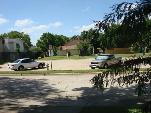 a view of yard with swimming pool and furniture