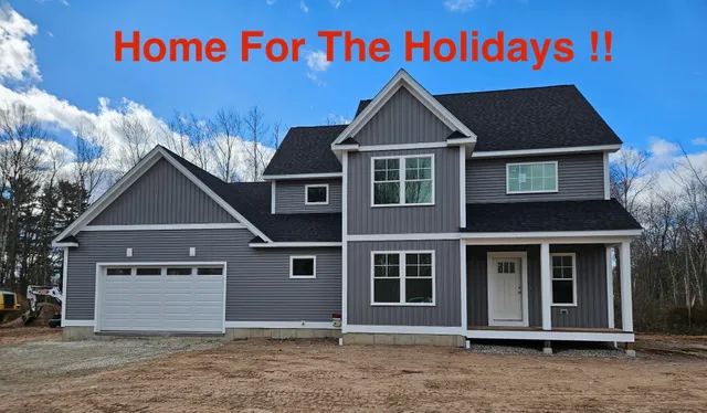 a front view of a house with a garage