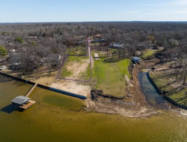 a view of a swimming pool with a yard