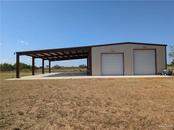 a view of an empty room with a garage