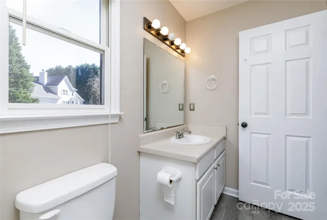 a view of empty room with fireplace and window