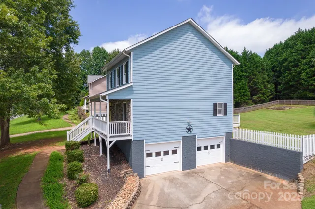 a house view with a sitting space and garden