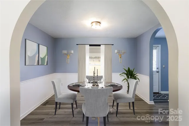 a view of a dining room with furniture and window