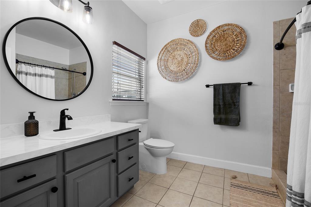24825 Northwest 201st Road High Springs, FL 32643 - Photo 22 of 31 a bathroom with a toilet and a sink