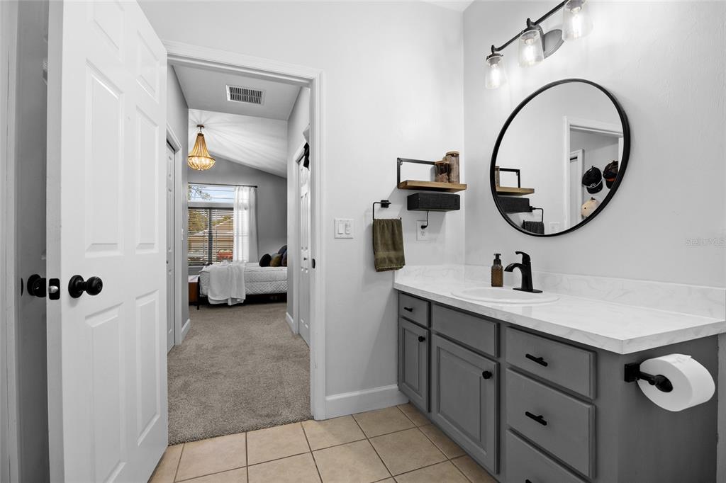 24825 Northwest 201st Road High Springs, FL 32643 - Photo 24 of 31 a bathroom with a sink and a mirror