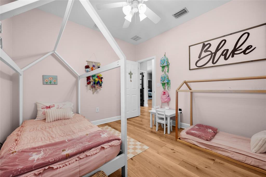 24825 Northwest 201st Road High Springs, FL 32643 - Photo 26 of 31 a bedroom with furniture and wooden floor