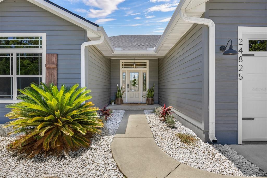 24825 Northwest 201st Road High Springs, FL 32643 - Photo 3 of 31 a view of a entryway door front of house