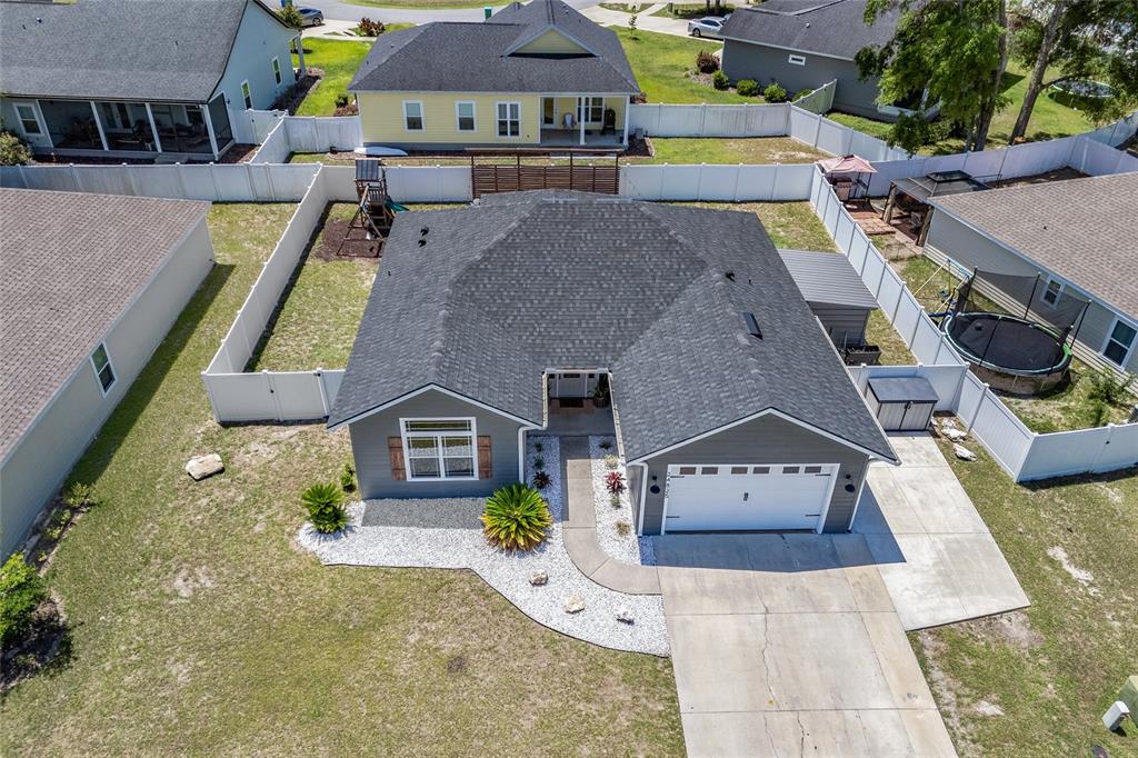 24825 Northwest 201st Road High Springs, FL 32643 - Photo 31 of 31 an aerial view of multiple houses with a yard