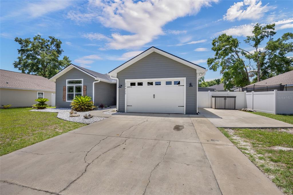 24825 Northwest 201st Road High Springs, FL 32643 - Photo 5 of 31 a view of garage and yard