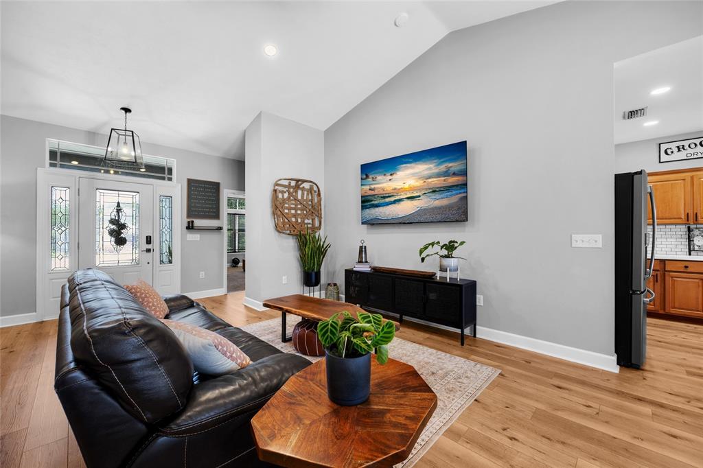 24825 Northwest 201st Road High Springs, FL 32643 - Photo 6 of 31 a living room with furniture and a flat screen tv