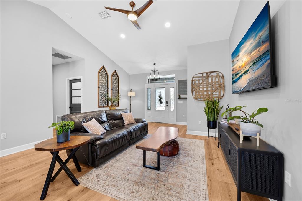 24825 Northwest 201st Road High Springs, FL 32643 - Photo 8 of 31 a living room with furniture and wooden floor