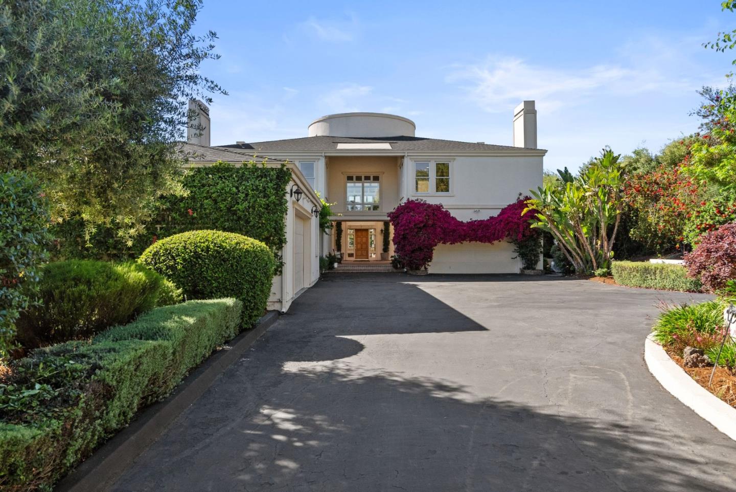 a front view of a house with garden