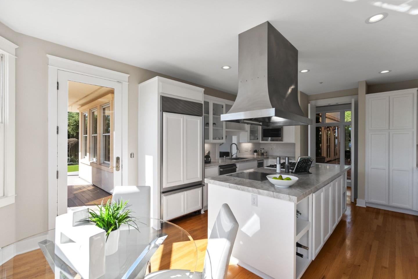 2589 Greenrock Road Milpitas, CA 95035 - Photo 16 of 76 a kitchen with stainless steel appliances kitchen island granite countertop a refrigerator a stove a sink dishwasher and a dining table with wooden floor