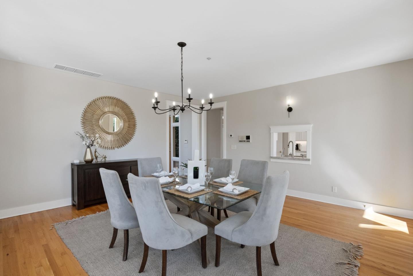 2589 Greenrock Road Milpitas, CA 95035 - Photo 18 of 76 a view of a dining room with furniture a chandelier and wooden floor
