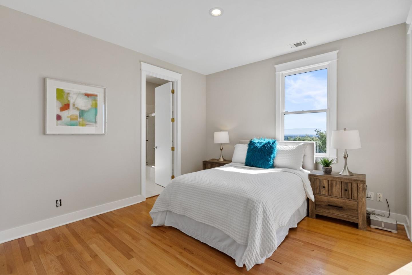 2589 Greenrock Road Milpitas, CA 95035 - Photo 36 of 76 a bedroom with a bed and wooden floor