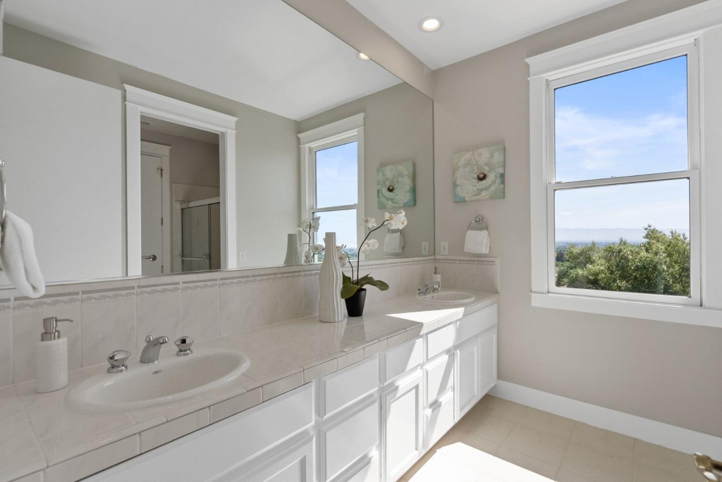 2589 Greenrock Road Milpitas, CA 95035 - Photo 38 of 76 a bathroom with a double vanity sink a mirror and a bathtub