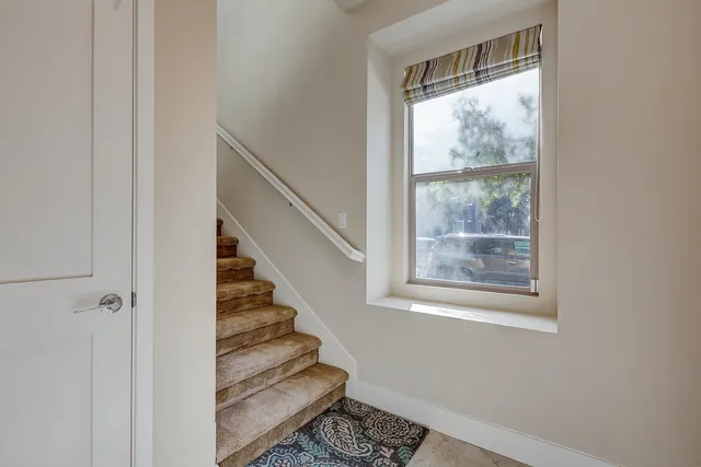 a view of entryway with wooden floor and door