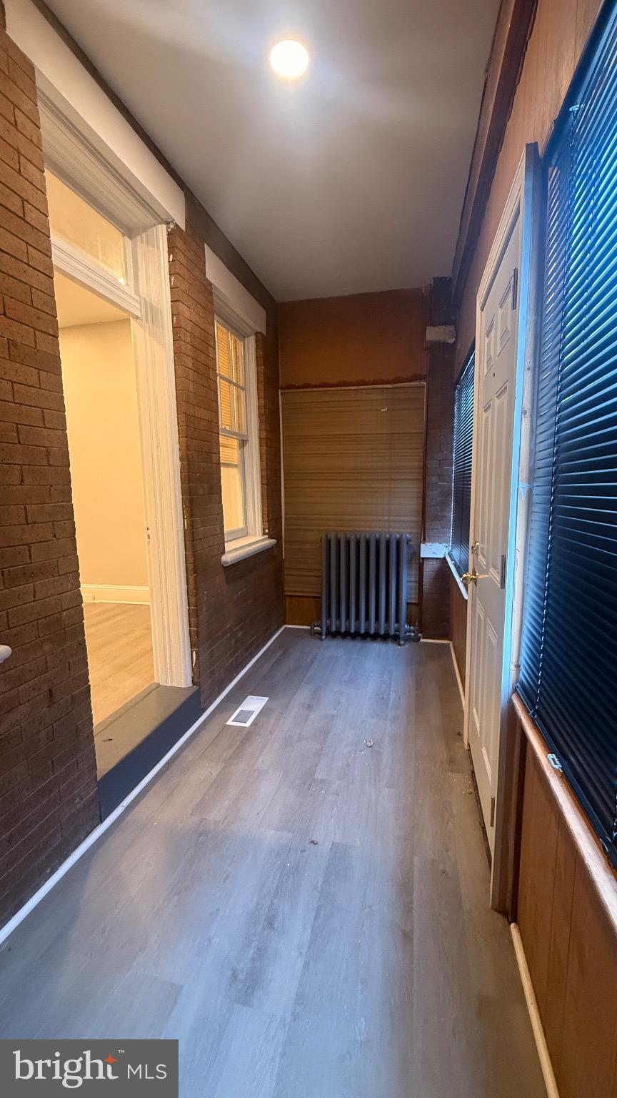 2148 South Lambert Street Philadelphia, PA 19145 - Photo 2 of 19 a view of empty room with wooden floor and fan