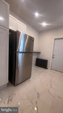 a refrigerator freezer sitting in a kitchen