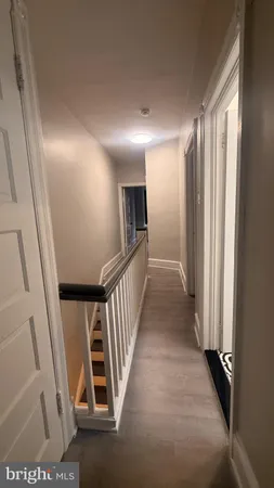 a view of a hallway with stairs