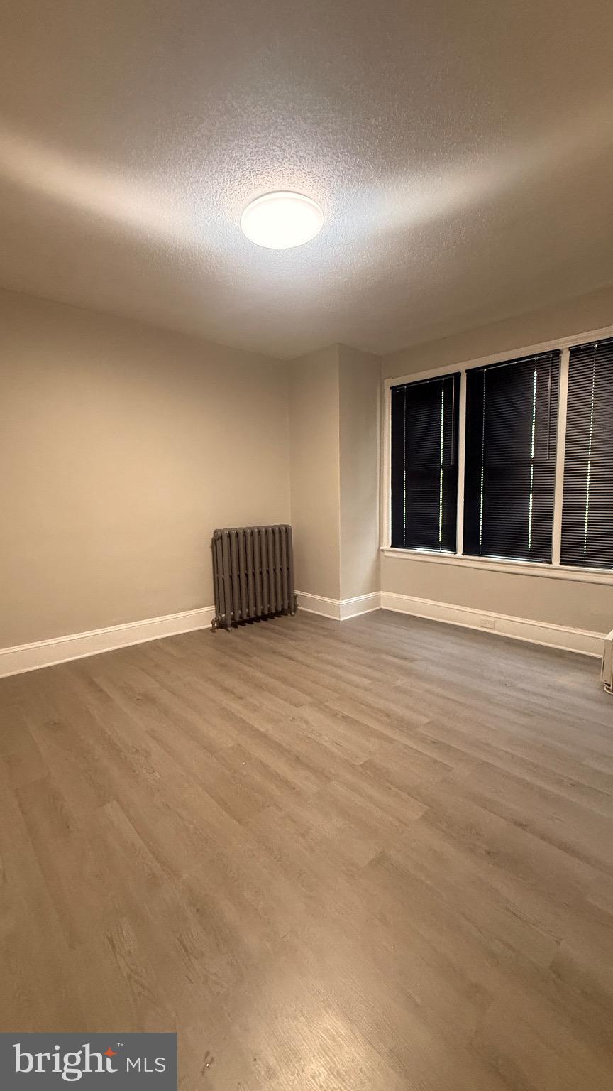 2148 South Lambert Street Philadelphia, PA 19145 - Photo 8 of 19 a view of an empty room with wooden floor