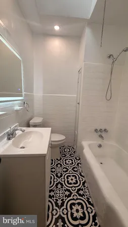 a bathroom with a sink and a bathtub