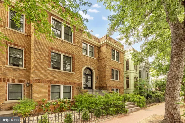 a front view of a multi story residential apartment building
