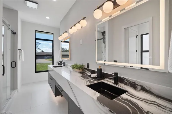 a bathroom with a sink and a mirror