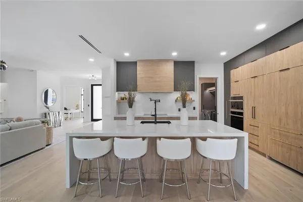 a kitchen with granite countertop cabinets and refrigerator