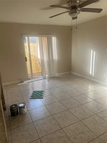 a view of an empty room and a window