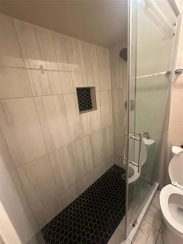 a bathroom with a sink and toilet