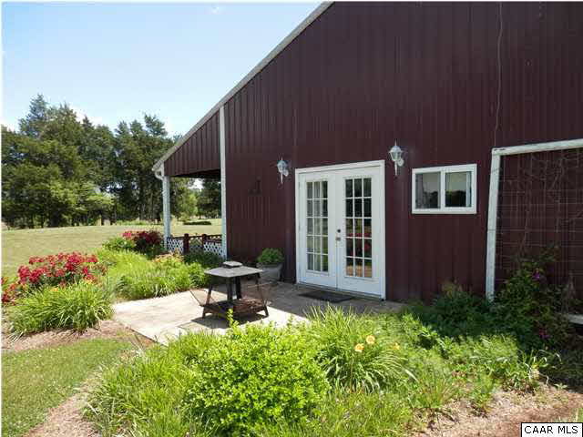22140 Monrovia Road Orange, VA 22960 - Photo 36 of 43 64' x 44' Metal Building, currently being used as a shop, but could easily be converted into stalls. There is a 1 Bedroom apartment attached with covered veranda and patio. The apt has its own Kit-Liv-Din area, 1 BR and 1 Full Bath & Laundry.