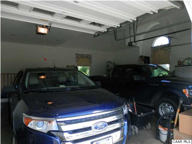 22140 Monrovia Road Orange, VA 22960 - Photo 42 of 43 Photo showing two oversized cars in the 28' x 26' attached garage.