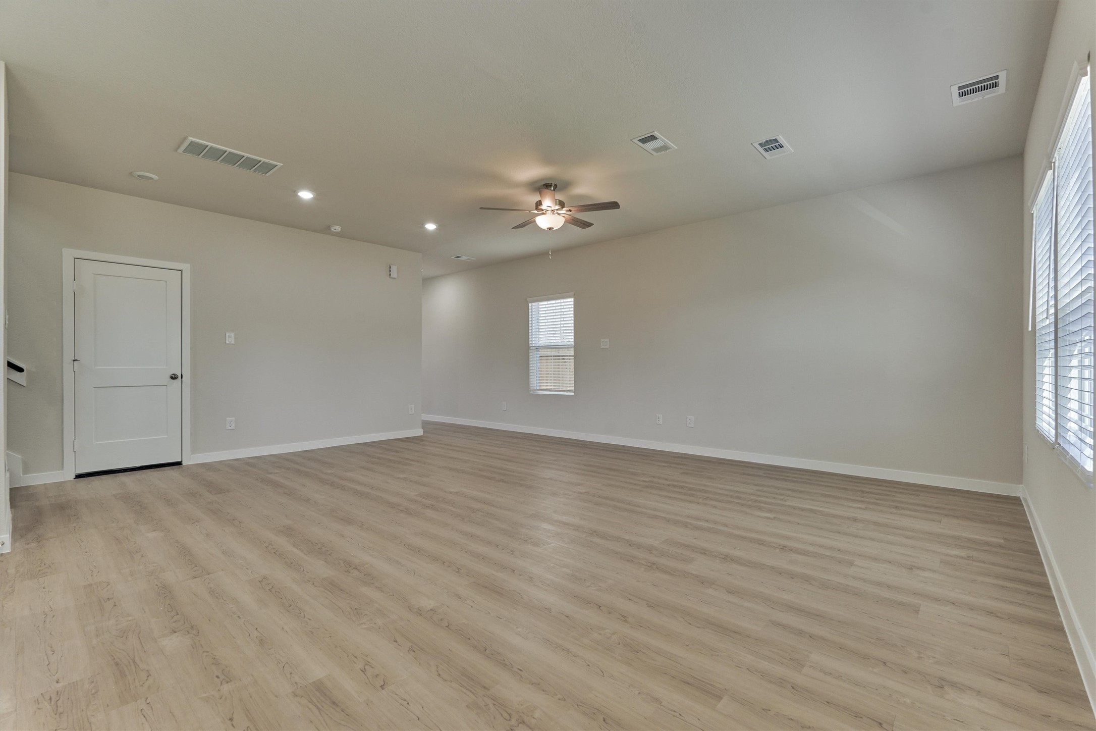 282 Brazen Forest Trail Magnolia, TX 77355 - Photo 11 of 36 wooden floor in an empty room with a window