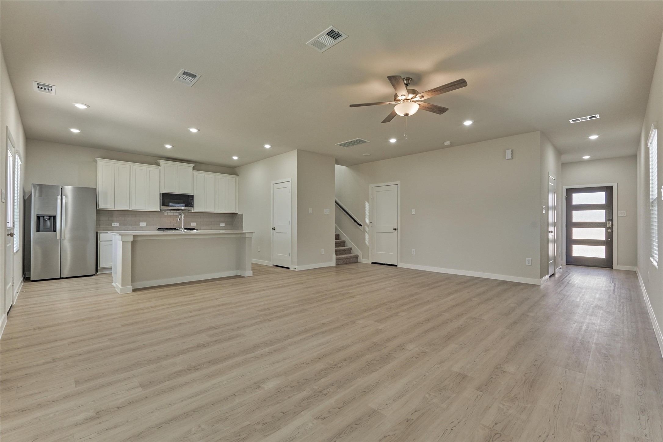 282 Brazen Forest Trail Magnolia, TX 77355 - Photo 12 of 36 a view of a kitchen with a sink and a stove
