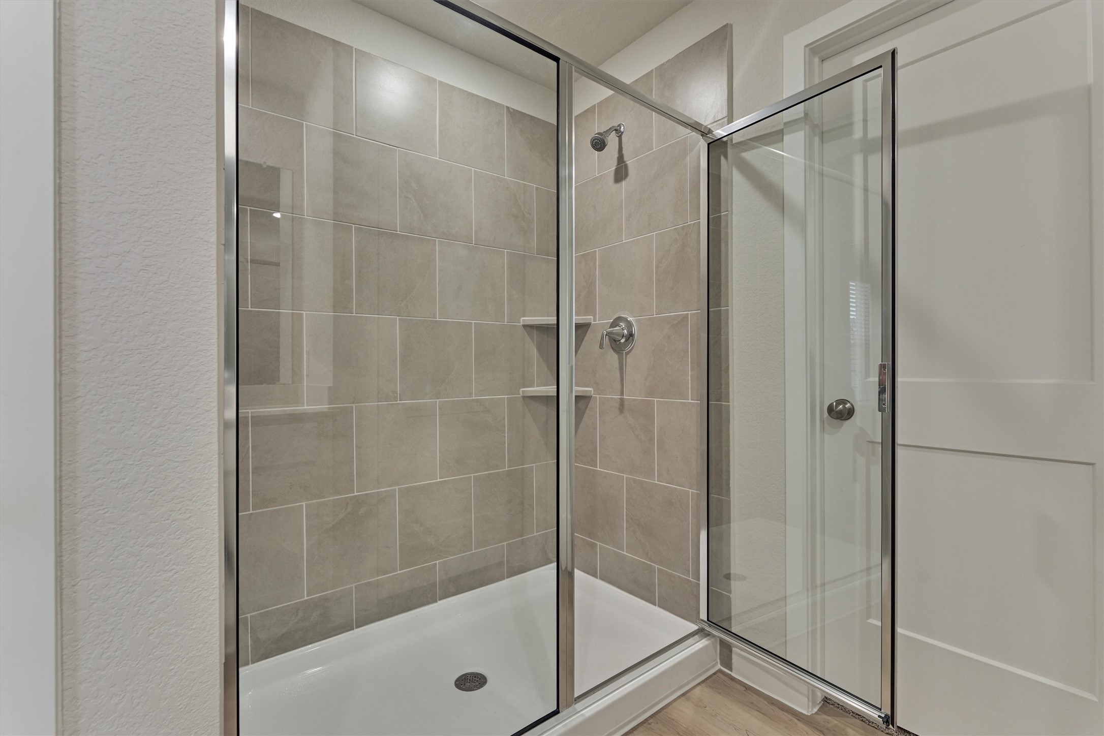 282 Brazen Forest Trail Magnolia, TX 77355 - Photo 21 of 36 a bathroom with a glass shower door