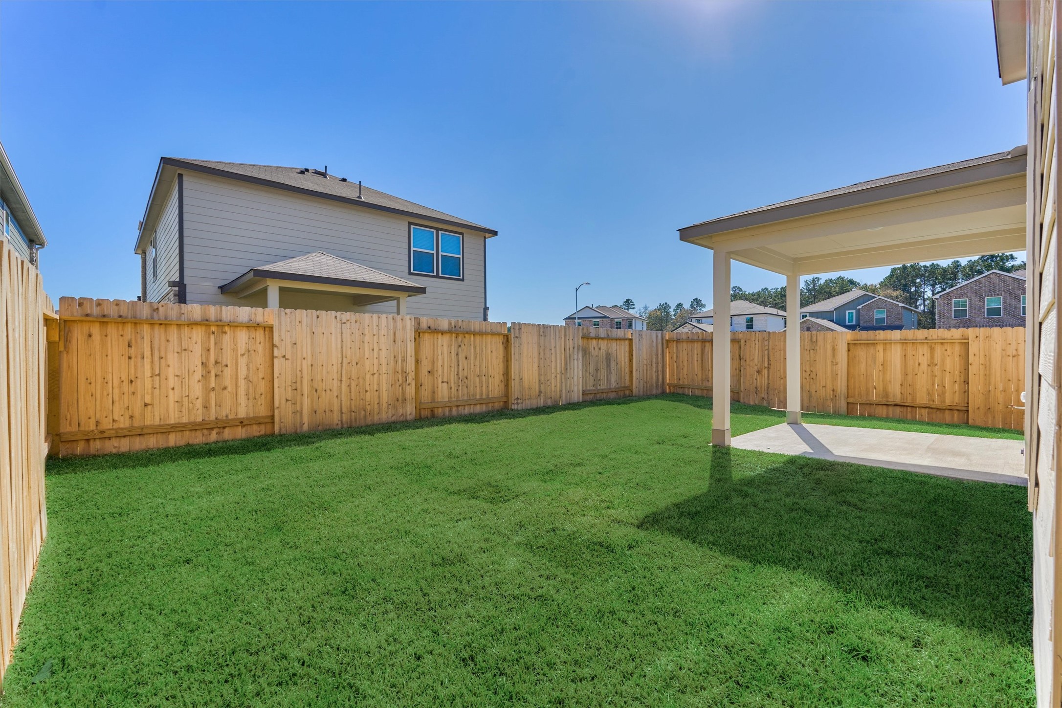 282 Brazen Forest Trail Magnolia, TX 77355 - Photo 32 of 36 a view of a backyard with wooden fence