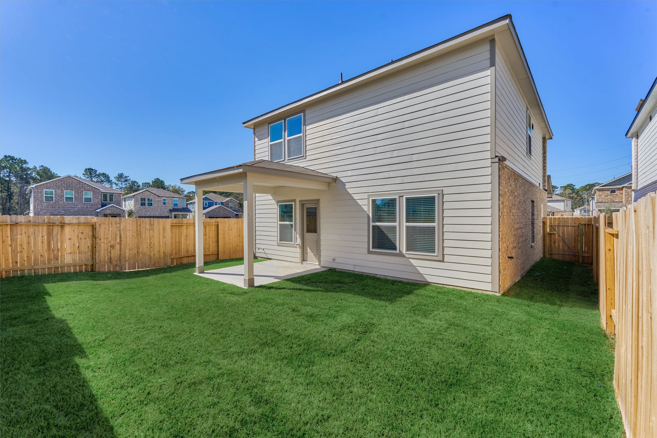 282 Brazen Forest Trail Magnolia, TX 77355 - Photo 33 of 36 a view of a house with a yard and sitting area