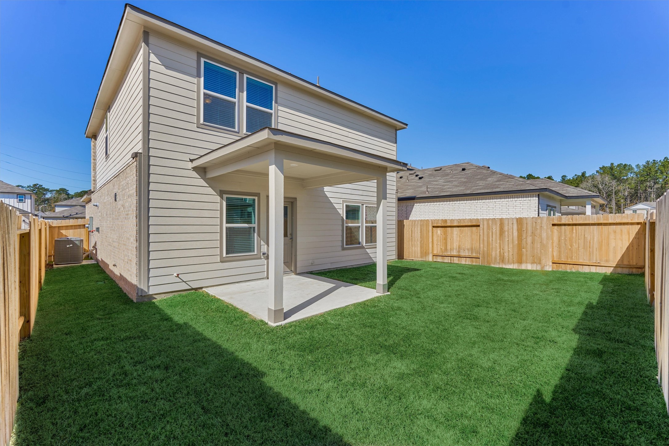282 Brazen Forest Trail Magnolia, TX 77355 - Photo 34 of 36 a view of a house with a backyard